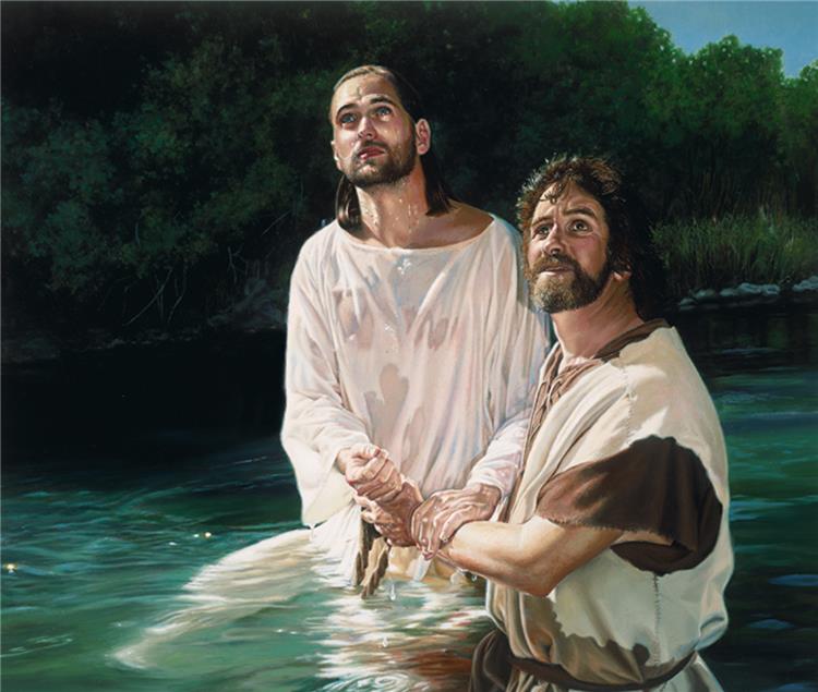Jesus is baptised in the River Jordan by John the Baptist